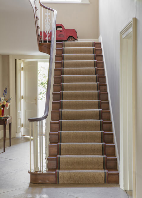 Alternative Flooring, Winter Trend Watch 2025, Sisal Herringbone Harestock Bespoke Stair Runner with a Rainbow Pride Colourful Patterned Border